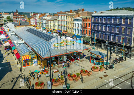 Aerial view of colorful Findlay market in the re-gentrified Over the Rhine neighborhood of Cincinnati Ohio USA with street vendors Stock Photo