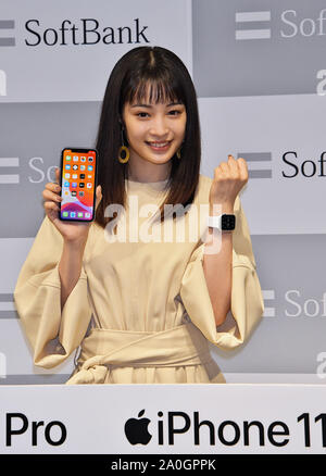 Japanese actress Hirose Suzu poses with new iPhone 11 and new