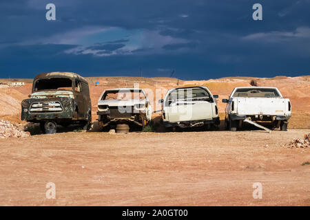 Wrecked cars in the red desert, Coober Pedy, South Australia Stock Photo
