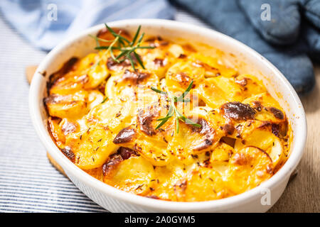 Roasted potatoes in baking dish traditional easten european food titled as france potato Stock Photo