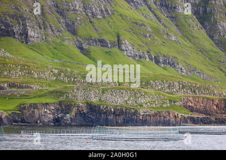 Salmon fishing farm pools in Faroe islands fjords. Aquaculture industry Stock Photo