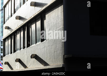 Generic architectural design of building exterior in Downtown Bangkok City in Thailand to show urban texture and city life Stock Photo