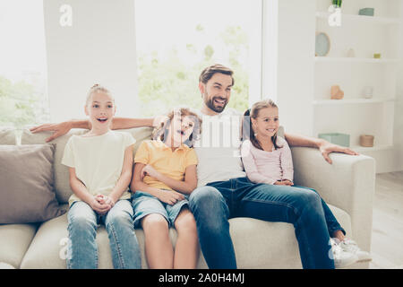 Sweet moments concept. Photo of relaxing, rest, chill family in everyday casual wear sit on comfort, cozy sofa in bright light modern living room and Stock Photo