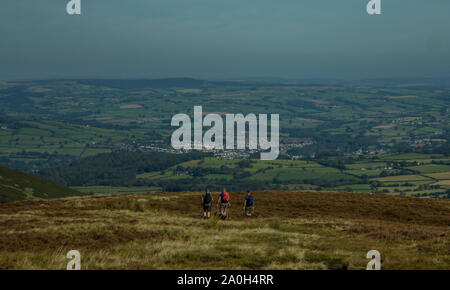 Hikers Walking Down Mountain Wales UK Stock Photo