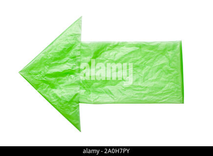 Arrow left from green bags isolated on a white background. Environmental pollution by disposable bags, recycling. Stock Photo