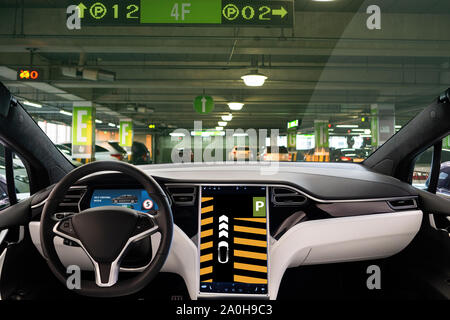 Self driving car in autonomous parking mode Stock Photo