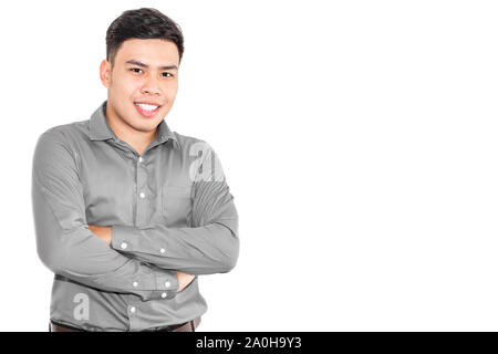 Thai man wearing a gray shirt and smiling brightly. Stock Photo