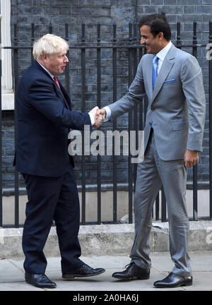 Prime Minister Boris Johnson welcomes the Emir of Qatar, Sheikh Tamim bin Hamad Al Thani, to 10 Downing Street, London, ahead of a bilateral meeting. Stock Photo