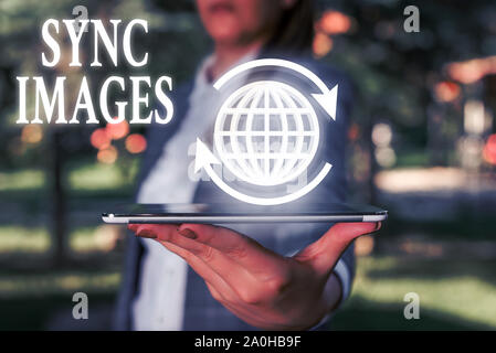 Handwriting text writing Sync Images. Conceptual photo Making photos identical in all devices Accessible anywhere Stock Photo