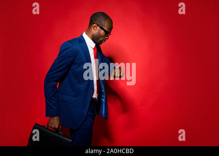 Focused busy broker chic classy concentrated confident banker financier mulatto people in trendy tux tuxedo formalwear deep blue style jacket pants lo Stock Photo