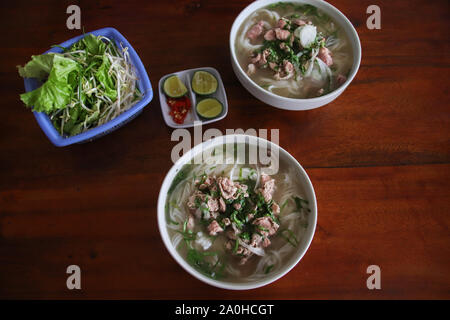 Iconic Vietnamese dish called pho bo or beef noodles soup Stock Photo