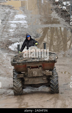 Vilnius, Lithuania - February 16: Small Dump Truck hauling ground during road construction on February 16, 2019. Vilnius is the capital of Lithuania a Stock Photo