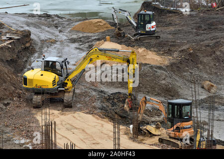 Vilnius, Lithuania - February 16: Excavators on construction site on February 16, 2019. Vilnius is the capital of Lithuania and its largest city. Stock Photo