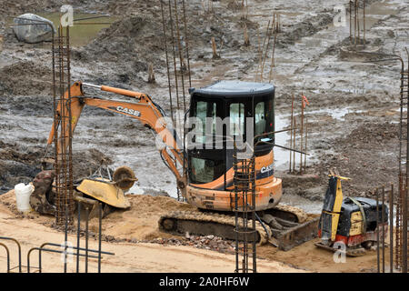 Vilnius, Lithuania - February 16: Excavator on construction site on February 16, 2019. Vilnius is the capital of Lithuania and its largest city. Stock Photo