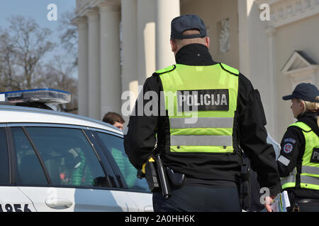 Vilnius, Lithuania - April 06: Police officers in Vilnius Old Town on April 06, 2019 in Vilnius Lithuania. Vilnius is the capital of Lithuania and its Stock Photo