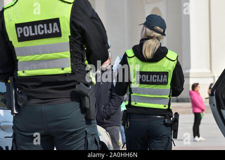 Vilnius, Lithuania - April 06: Police officers in Vilnius Old Town on April 06, 2019 in Vilnius Lithuania. Vilnius is the capital of Lithuania and its Stock Photo