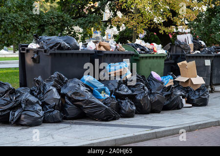 https://l450v.alamy.com/450v/2a0hj65/huge-garbage-piles-next-to-the-dumpster-after-city-fair-stacks-of-litter-bags-overflow-trash-cans-after-festival-in-a-city-2a0hj65.jpg