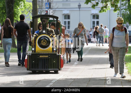 Vilnius, Lithuania - May 18: Unidentified people in childrens summer attraction locomotive on May 18, 2019 in Vilnius Lithuania. Vilnius is the capita Stock Photo