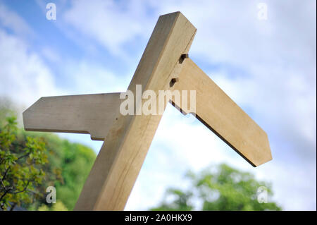 a blank wooden sign post pointing in two directions Stock Photo