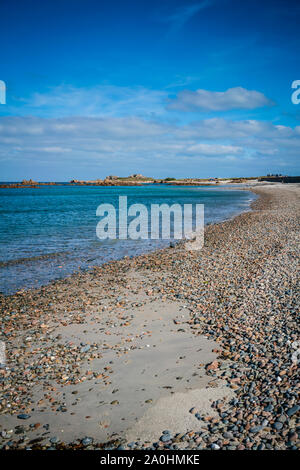 Beautiful sun drenched Cobo Bay on the west coast of the island of Guernsey in the Channel Islands, UK. Stock Photo