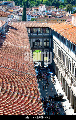 Aerial view of the Uffizi gallery in Florence with unrecognizable tourists and the Arno river in the background Stock Photo