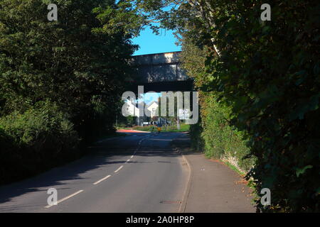 The steel constructed railway crossing bridge at the North end of Llantwit Major town where the tracks cross the high street in this busy town. Stock Photo