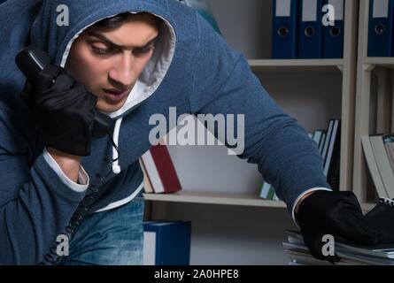 The young man in industrial espionage concept Stock Photo