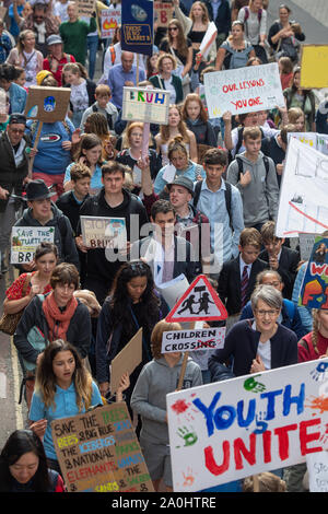 People march through the streets as part of the UK Student Climate Network's Global Climate Strike in Cambridge. Stock Photo