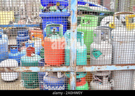 gas bottles in safety cage waiting for recycling at council household recycling centre united kingdom Stock Photo