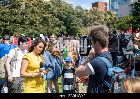 Sky news woman presenter and cameraman at the sydney climate change strike protest in the Domain,Sydney,Australia Stock Photo