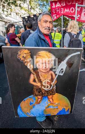 London, UK. 20th Sep, 2019. Satirist Kaya Mar with his late3st 'cartoon' - A general strike for Climate Justice, attended by school children, students and adults, is organised by Extinction Rebellion, Greenpeace, Save the Earth and other groups campaigning for the environment. They are again highlighting the climate emergency, with time running out to save the planet from a climate disaster. This is part of the ongoing ER and other protests to demand action by the UK Government on the 'climate crisis'. The action is part of an international co-ordinated protest. Credit: Guy Bell/Alamy Live New Stock Photo