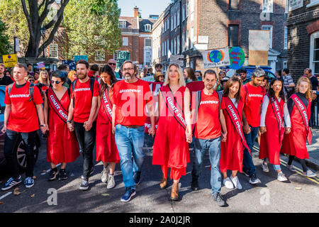 London, UK. 20th Sep, 2019. Greenpeace repriese their red dresses - A general strike for Climate Justice, attended by school children, students and adults, is organised by Extinction Rebellion, Greenpeace, Save the Earth and other groups campaigning for the environment. They are again highlighting the climate emergency, with time running out to save the planet from a climate disaster. This is part of the ongoing ER and other protests to demand action by the UK Government on the 'climate crisis'. The action is part of an international co-ordinated protest. Credit: Guy Bell/Alamy Live News Stock Photo