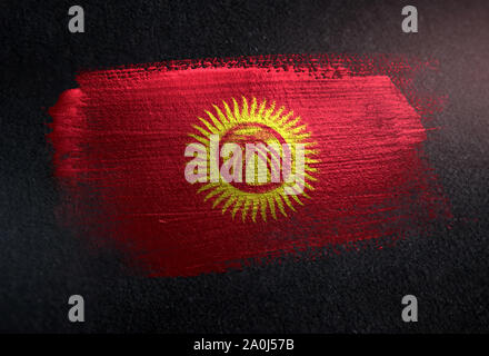 Kyrgyzstan Flag Made of Metallic Brush Paint on Grunge Dark Wall Stock Photo