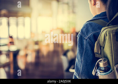 Girl with backpack entering to the classroom, Education concept. Stock Photo