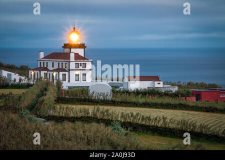 Lighthouse at Ferraria, Farol da Ferraria, Açores, Portugal Stock Photo