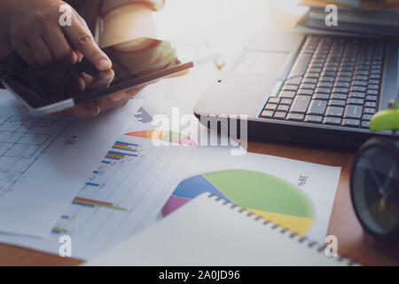 Hands of woman using tablet on working desk in office. Business concept. Stock Photo