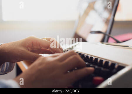 Hands of woman typing on working desk in office. Office life and education concept. Stock Photo