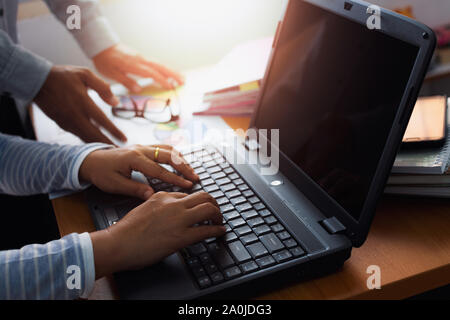 Two colleagues discussing and planing together on office desk, Business concept. Stock Photo