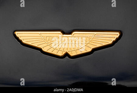 The gold wings logo of Aston Martin on a car hood Stock Photo