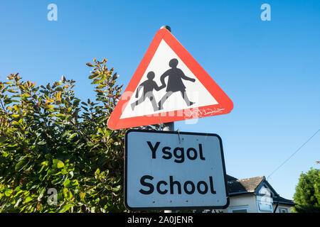Bilingual sign school ysgol welsh English warning triangle sign Stock ...