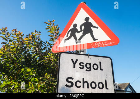 Bilingual sign school ysgol welsh English warning triangle sign Stock ...