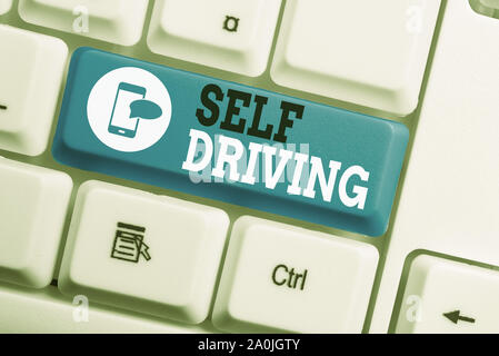 Conceptual hand writing showing Self Driving. Concept meaning Autonomous vehicle Ability to navigate without huanalysis input Keyboard with note paper Stock Photo