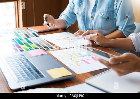 business technology concept, creative team designer choosing samples with UI/UX developing on sketch layout design mockup on smartphone application fo Stock Photo