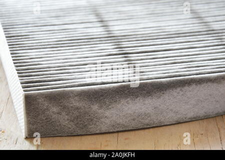 car air filter on wooden board Stock Photo