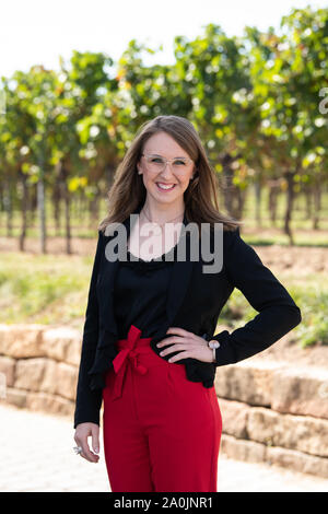 Palatinate, Germany. 20th Sep, 2019. Meike Klohr, candidate for the election of the German Wine Queen 2019 from the wine region 'Pfalz' smiles into the photographer's camera during a photo session at the Isler winery. Credit: dpa picture alliance/Alamy Live News Stock Photo