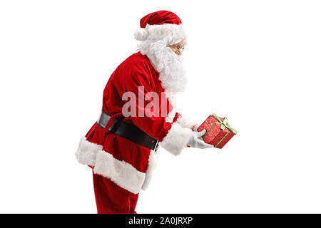 Profile of Santa Claus giving a present isolated on white background Stock Photo