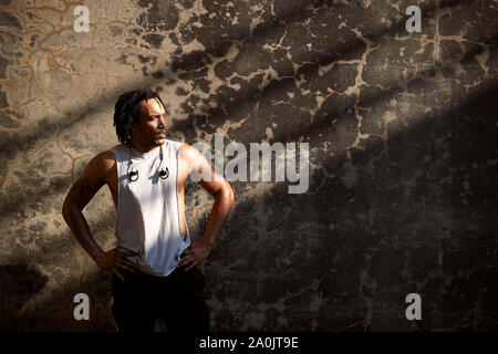 African-American man with hands on hips after workout Stock Photo