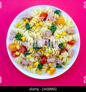 Tuna and Sweetcorn Healthy Pasta Salad With, Broccoli Florets, Cherry Tomatoes and Fusilli Pasta Stock Photo