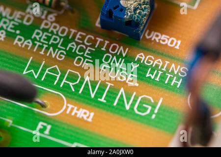 Close up shot of PCB unit with visible resistors, capacitors and micro procesors. Stock Photo