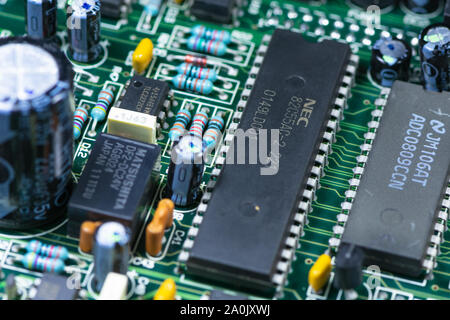 Close up shot of PCB unit with visible resistors, capacitors and micro procesors. Stock Photo